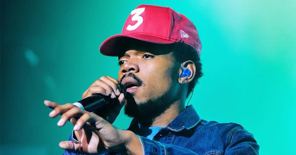 Chance the Rapper performs live, sporting his signature "3" hat. 