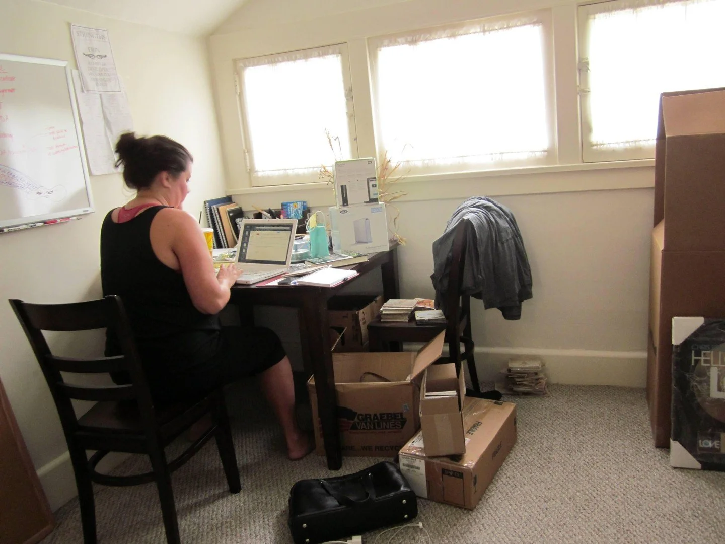 Today is officially the 14th anniversary of Olivia Management. Here is a photo of me, alone in my attic apartment in the first few months of running this company. That young lady would be THRILLED to know we are still going strong, still working on a