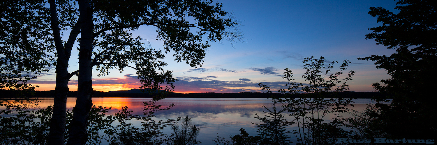 St. Regis Mountain at sunset with Lake Clear in the foreground. 