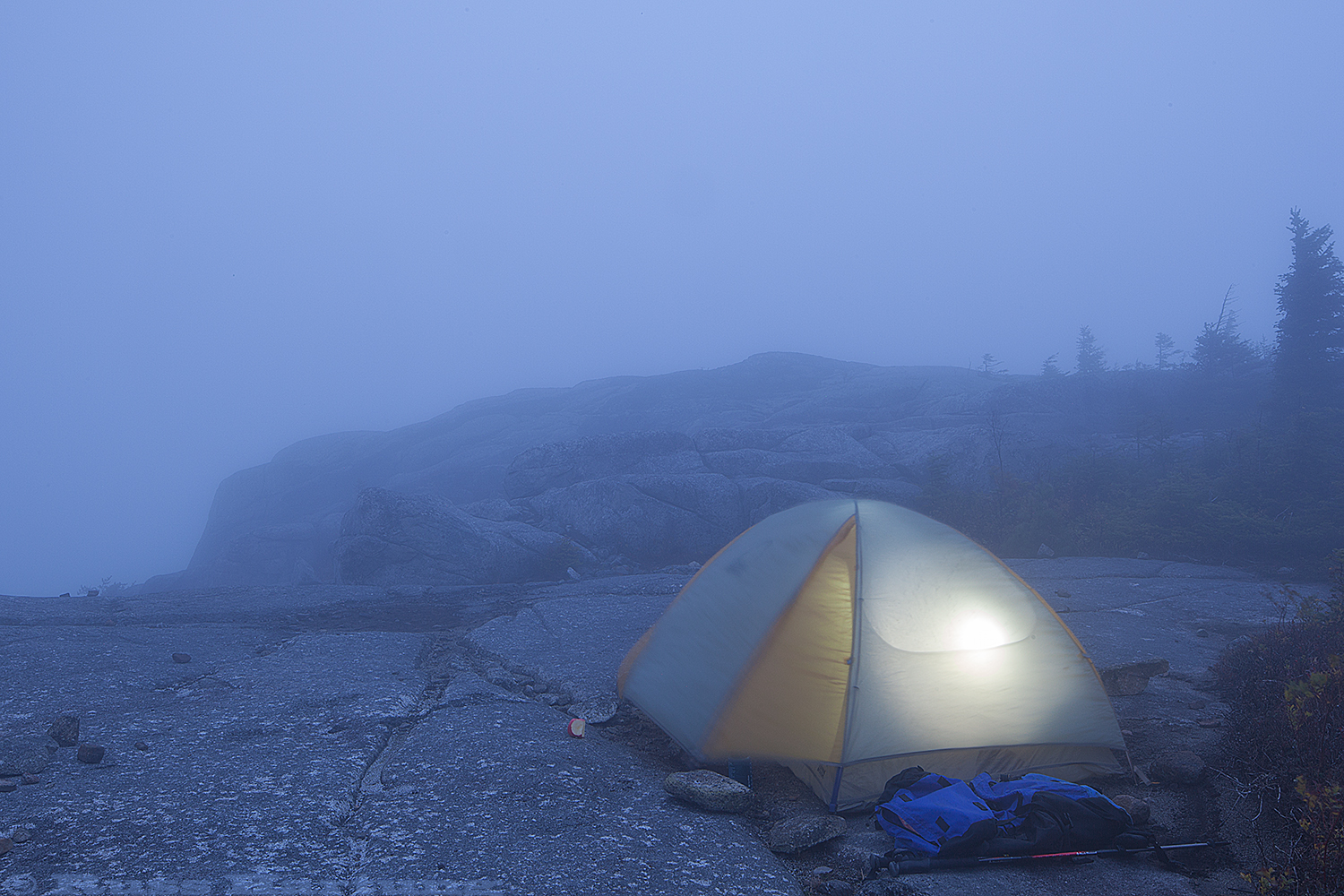 I spent the night on a ridge off the trail so I could do some sunrise photography. Instead I woke up to wind and thick fog. 
