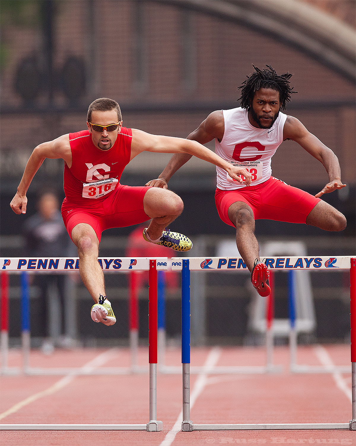 These hurdlers seem to be synchronized at the Penn Relays. 