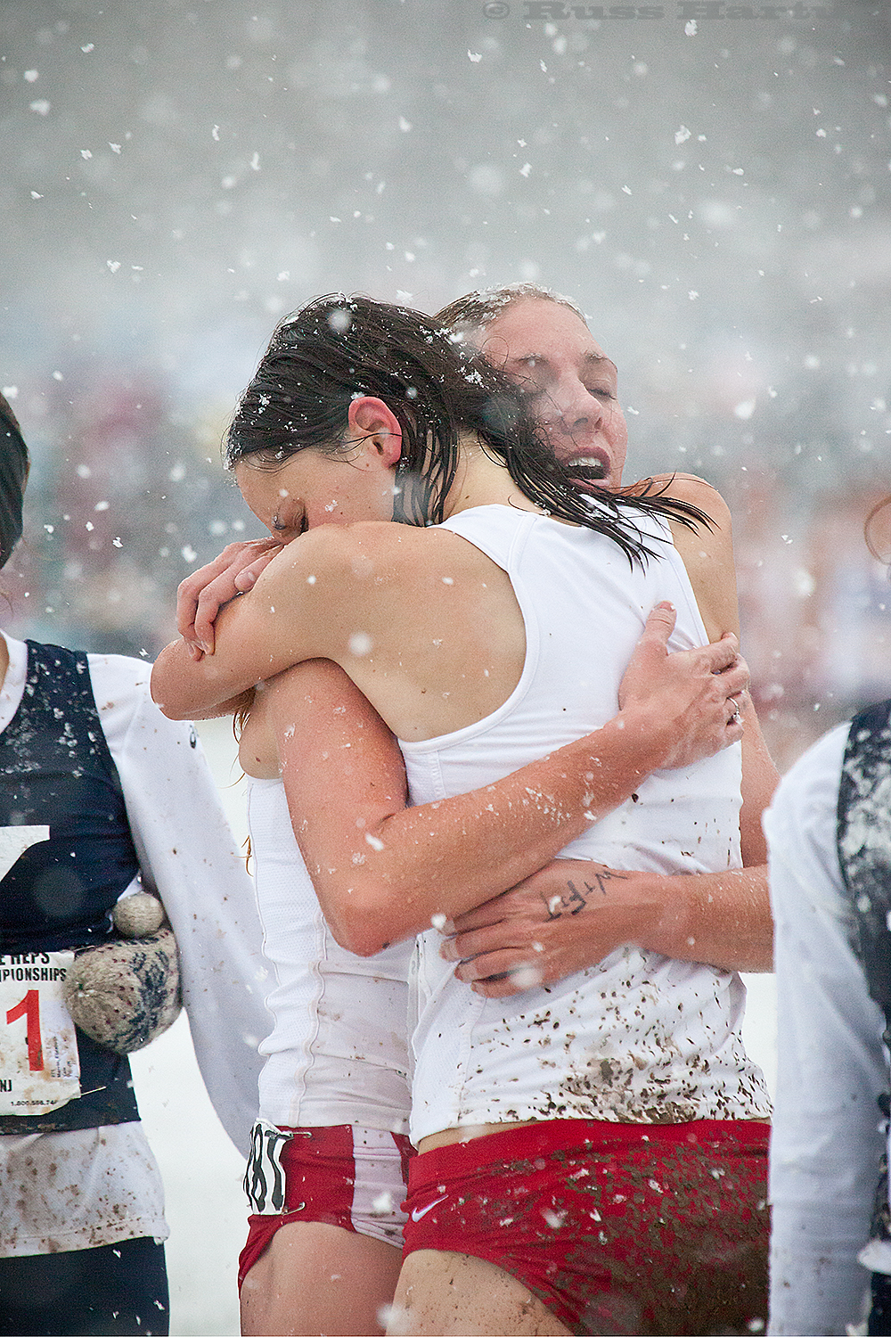 Warriors' embrace after a valiant and winning effort (in a freak October snowstorm) at the 2011 Heptagonal Cross-Country Championsips in Princeton. 