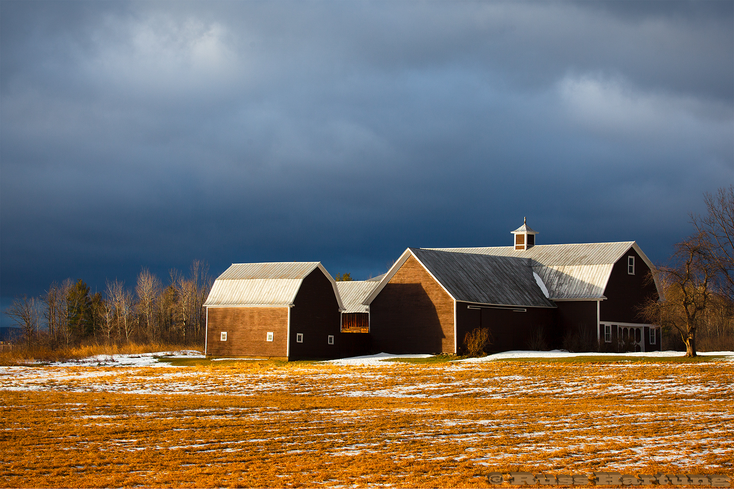 Sunrise highlights this barn in Plattsburgh, New York while the sky was still dark from a passing storm. 