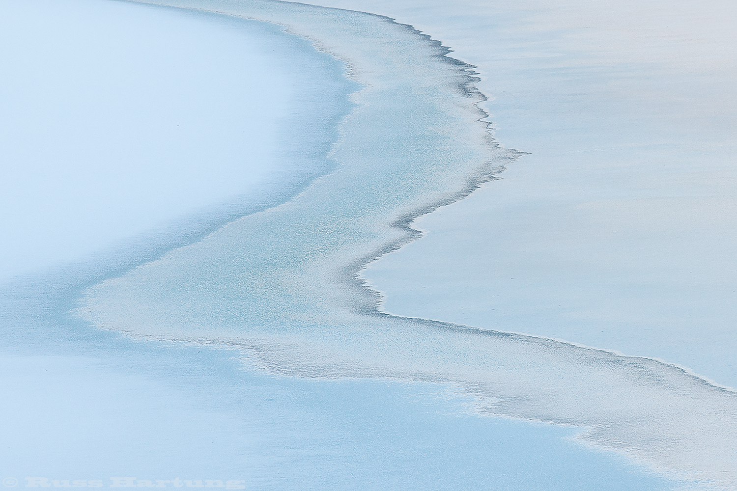 "Yin Yang Ice". Abstract shapes on a frozen stream. 