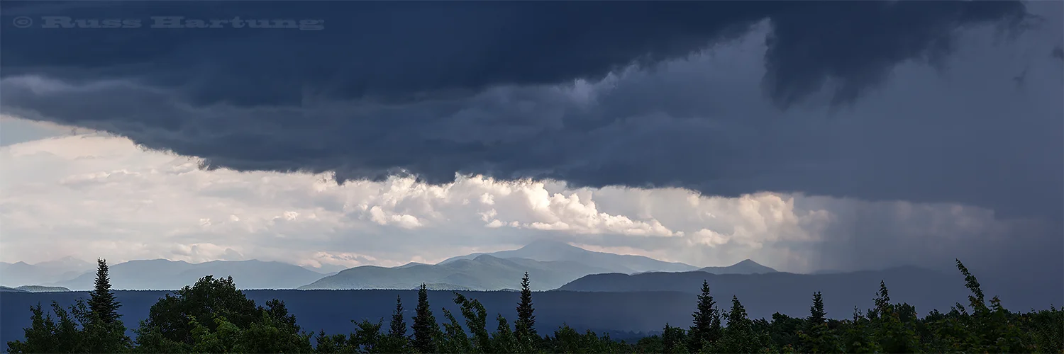 A storm moving in from the West over the High Peaks from the North.