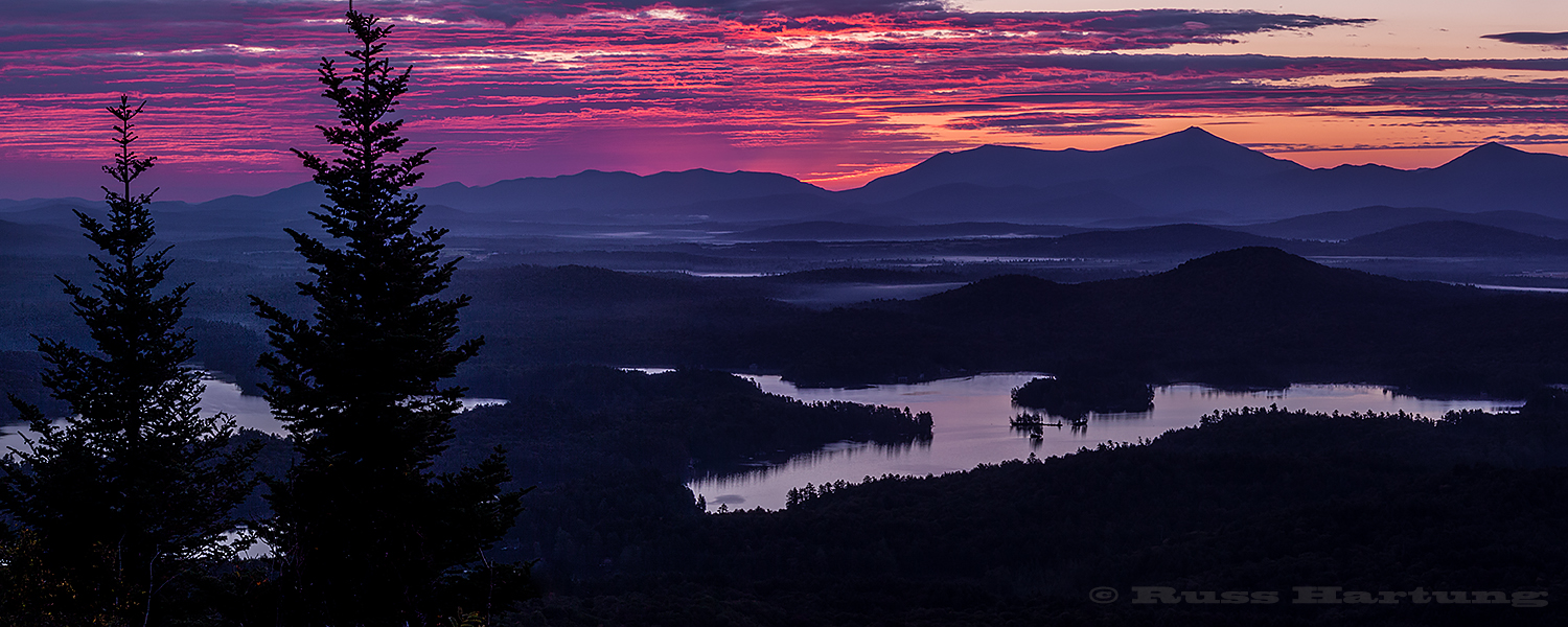 View over the St. Regis Canoe Wilderness from the top of St. Regis mountain at sunrise. 