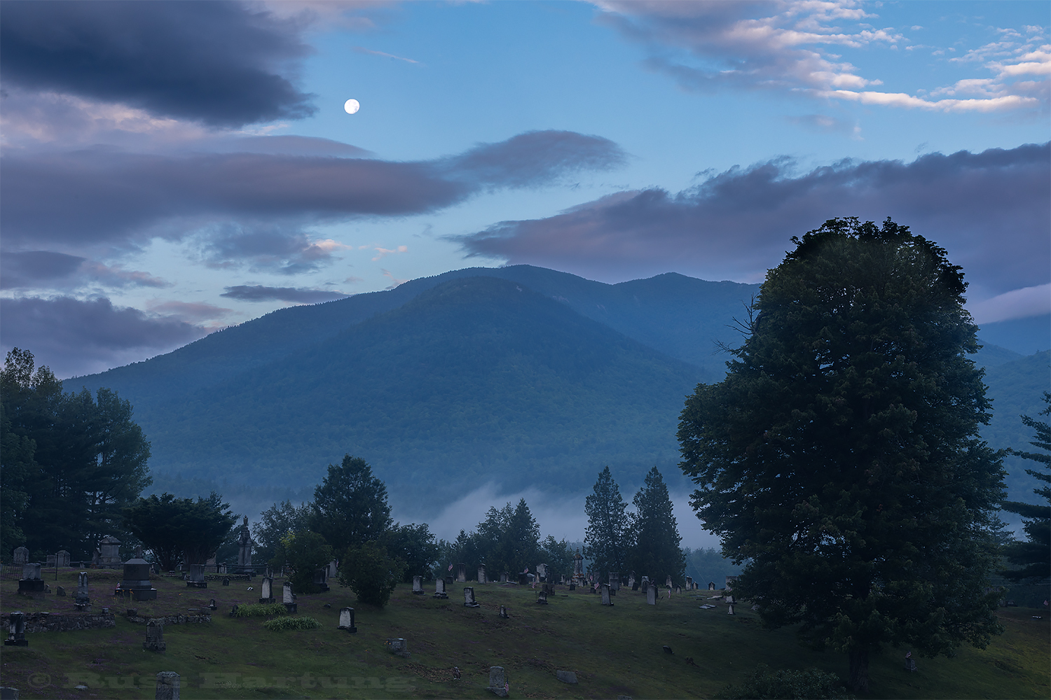 Moonset over Porter and Cascade from the cemetery in Keene. 