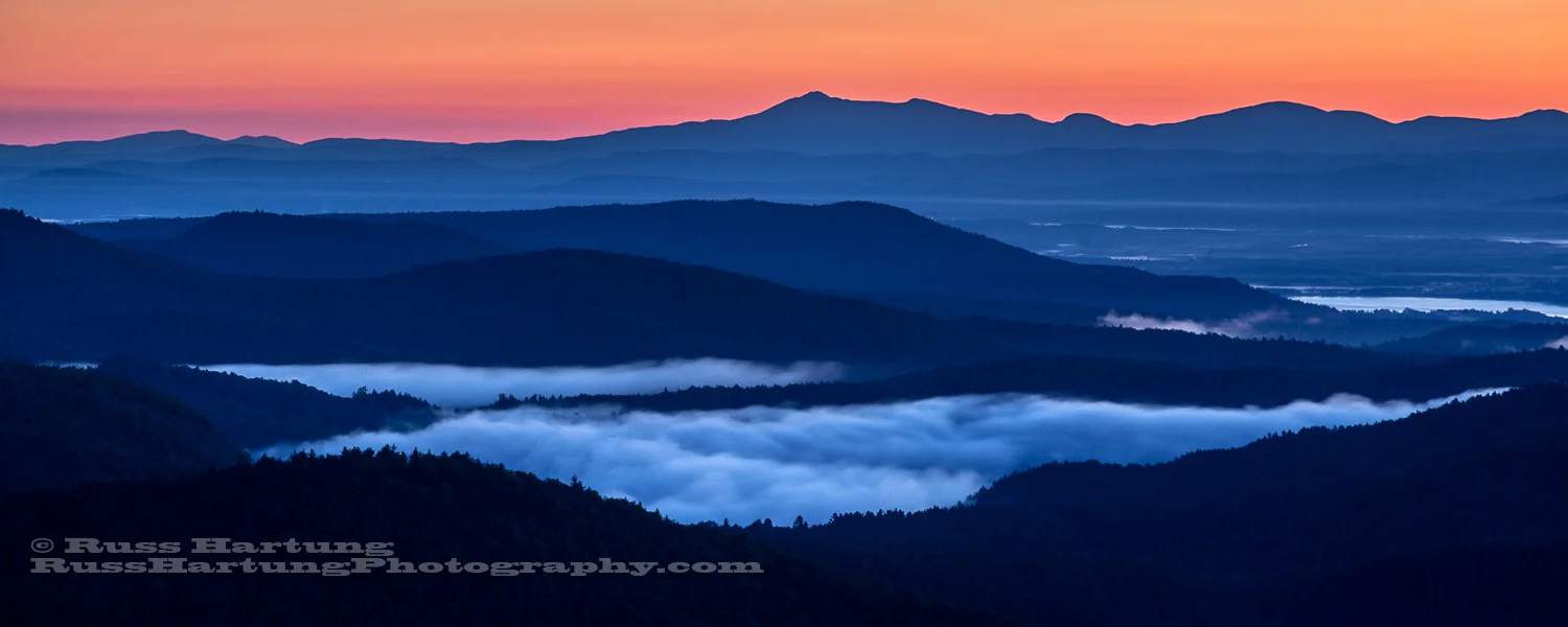 Fog in the valleys at dawn looking East from Pharoah Mountain.
