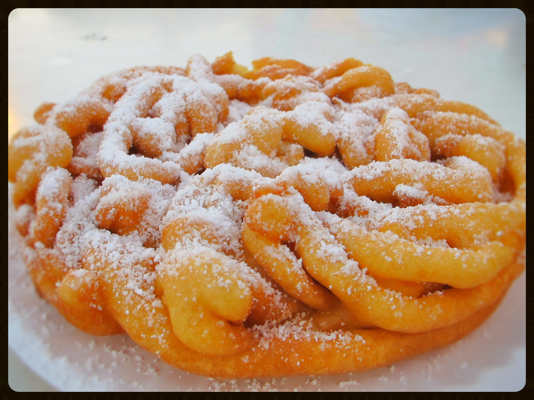 Classic Funnel Cake, Fried in all vegetable oil until golden brown, finished with powdered sugar.
