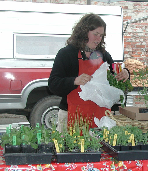 Farmer, Kate Dean, vending downtown Port Townsend in the early days of our market.