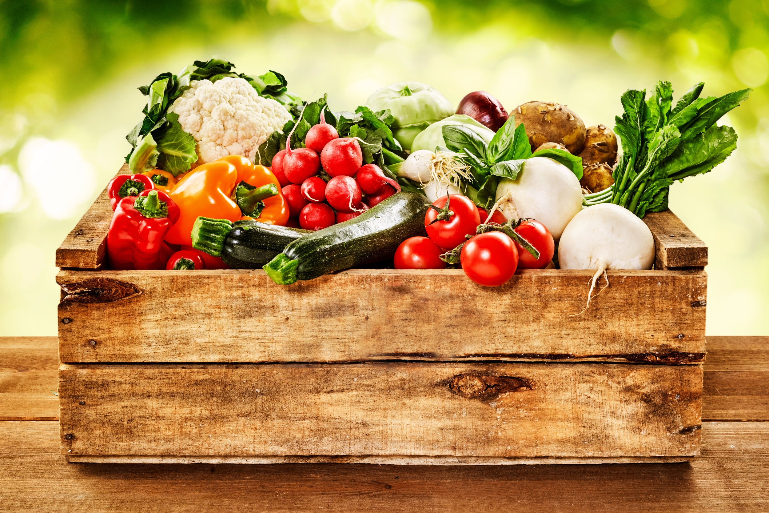 Wooden crate of farm fresh vegetables