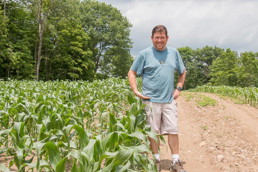  Mike checking out The Farm’s Famous Sweet Corn.  “knee high by the fourth of July” - connecting between the field to the farm stand.  