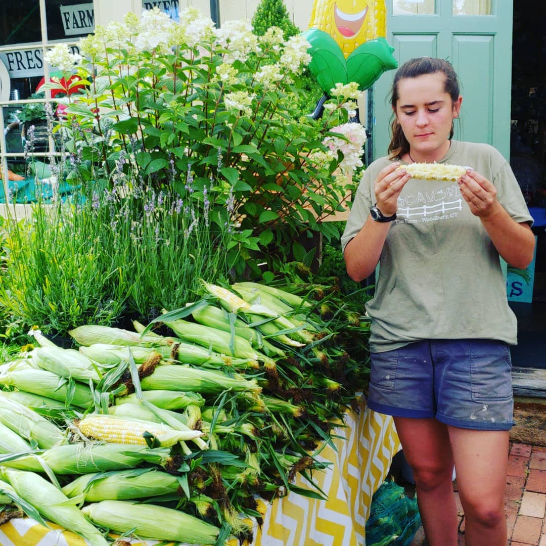  Claire taste testing The Farm’s Famous Corn.  We like our farm-stand help know the flavor and quality of each offering.   
