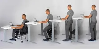 Image of man working with an adjustable desk