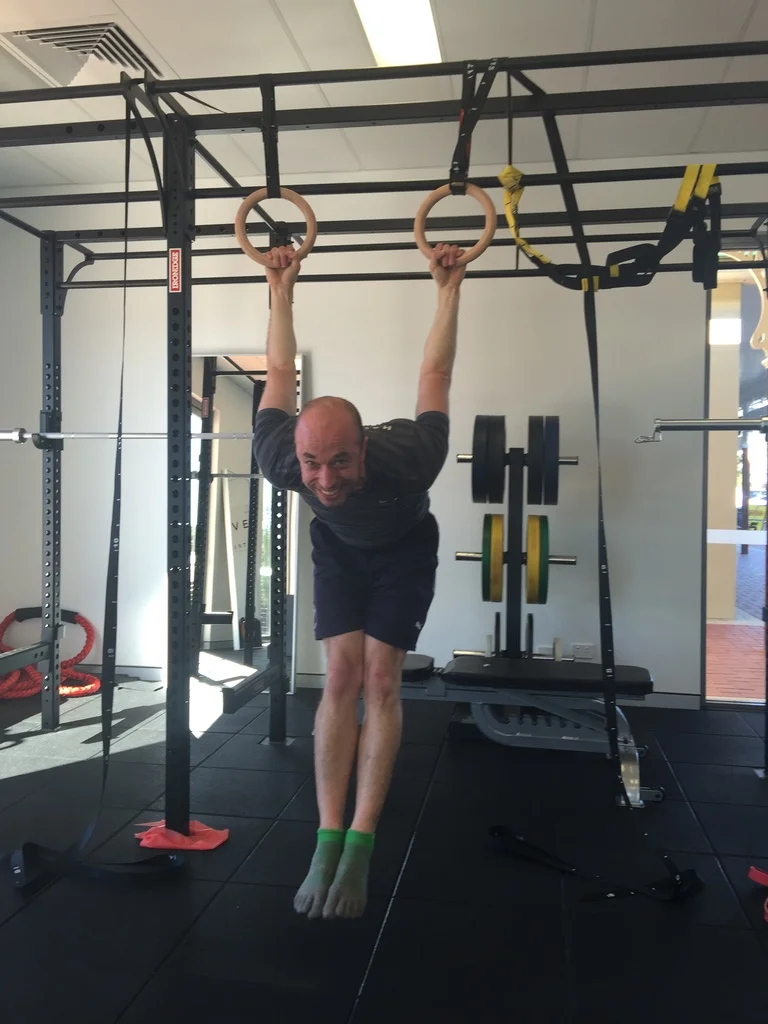 Messing around on the rings at the clinic.
