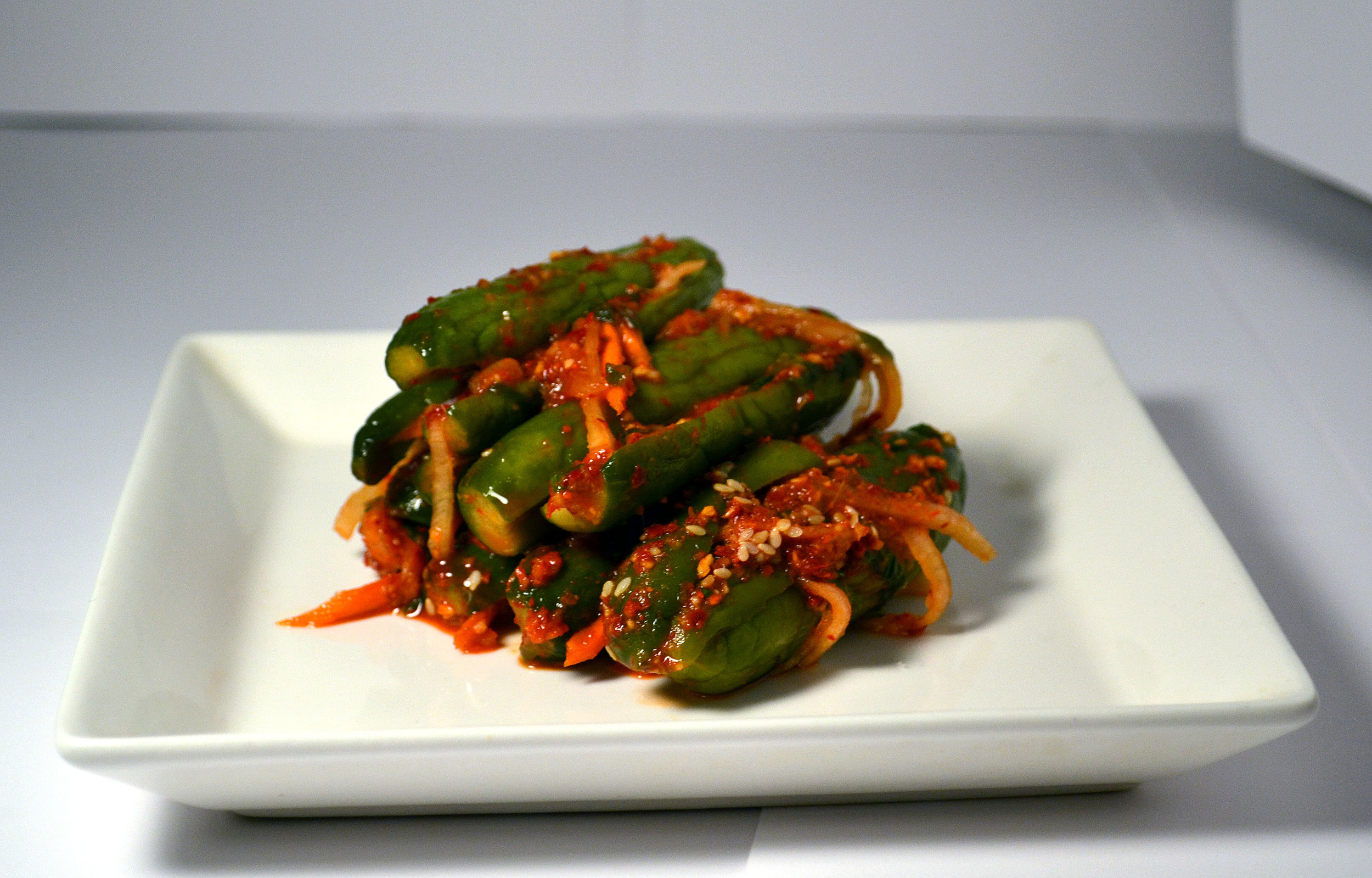 STUFFED CUCUMBERS: Spicy yet the cucumbers bring the spice down a bit. Pack with a crunch and a refreshing quality, the Stuffed Cucumbers are a great snack, side, or a special treat!