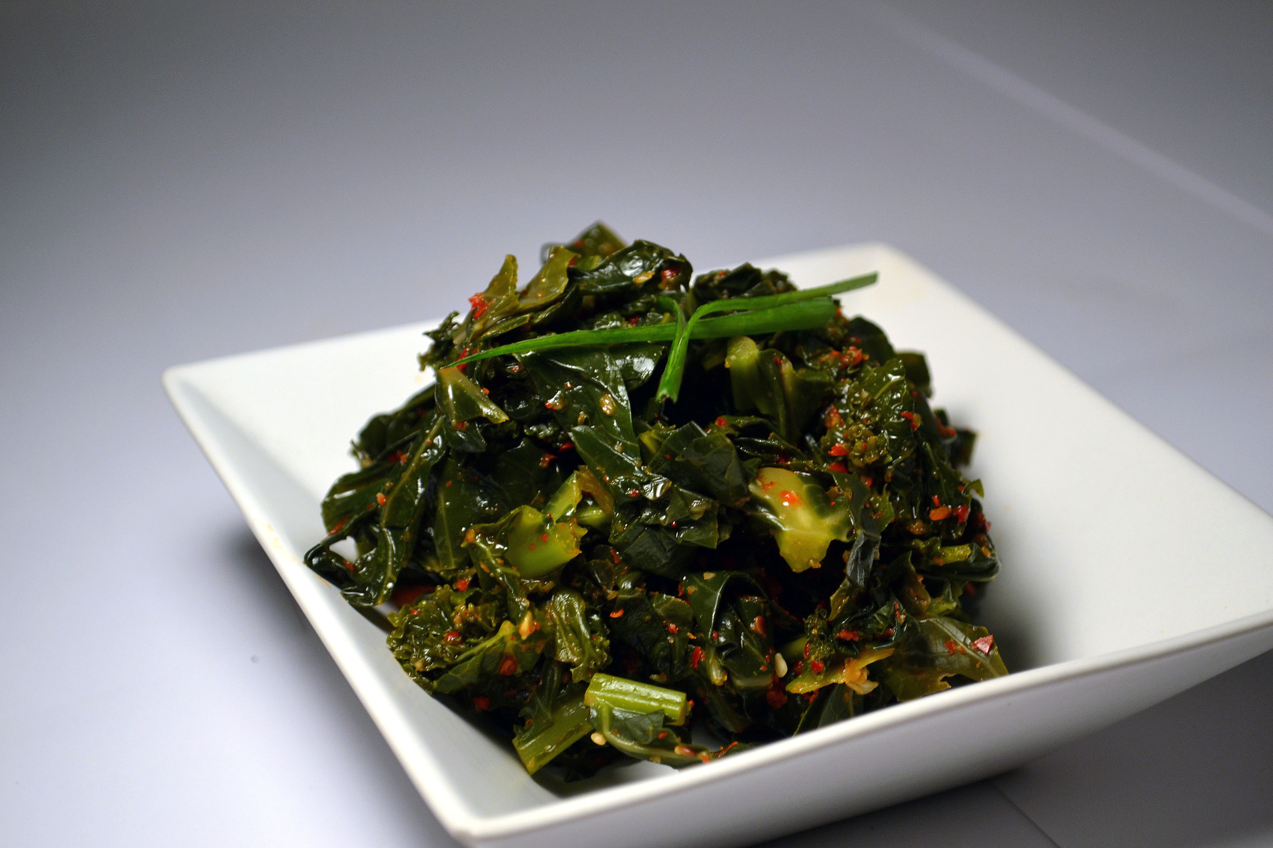 KALE KIMCHI: One of the densest and nutrient packed vegetables, Kale Kimchi is a super food. We pulverize the hard middle stem and mix it in the sauce, to make sure you get your fiber!