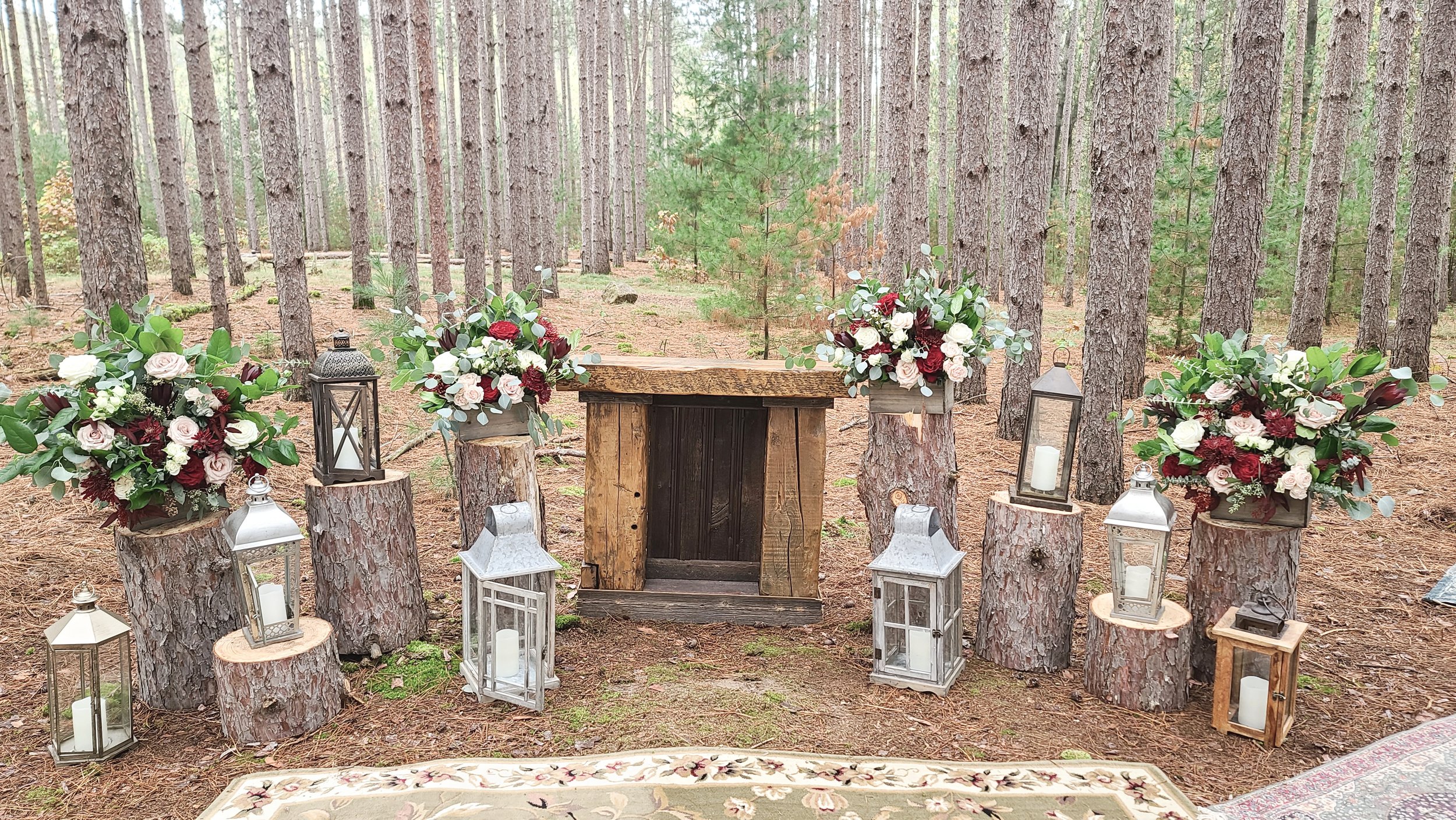 Rustic, yet enchanted look -all floral centerpieces in wood boxes