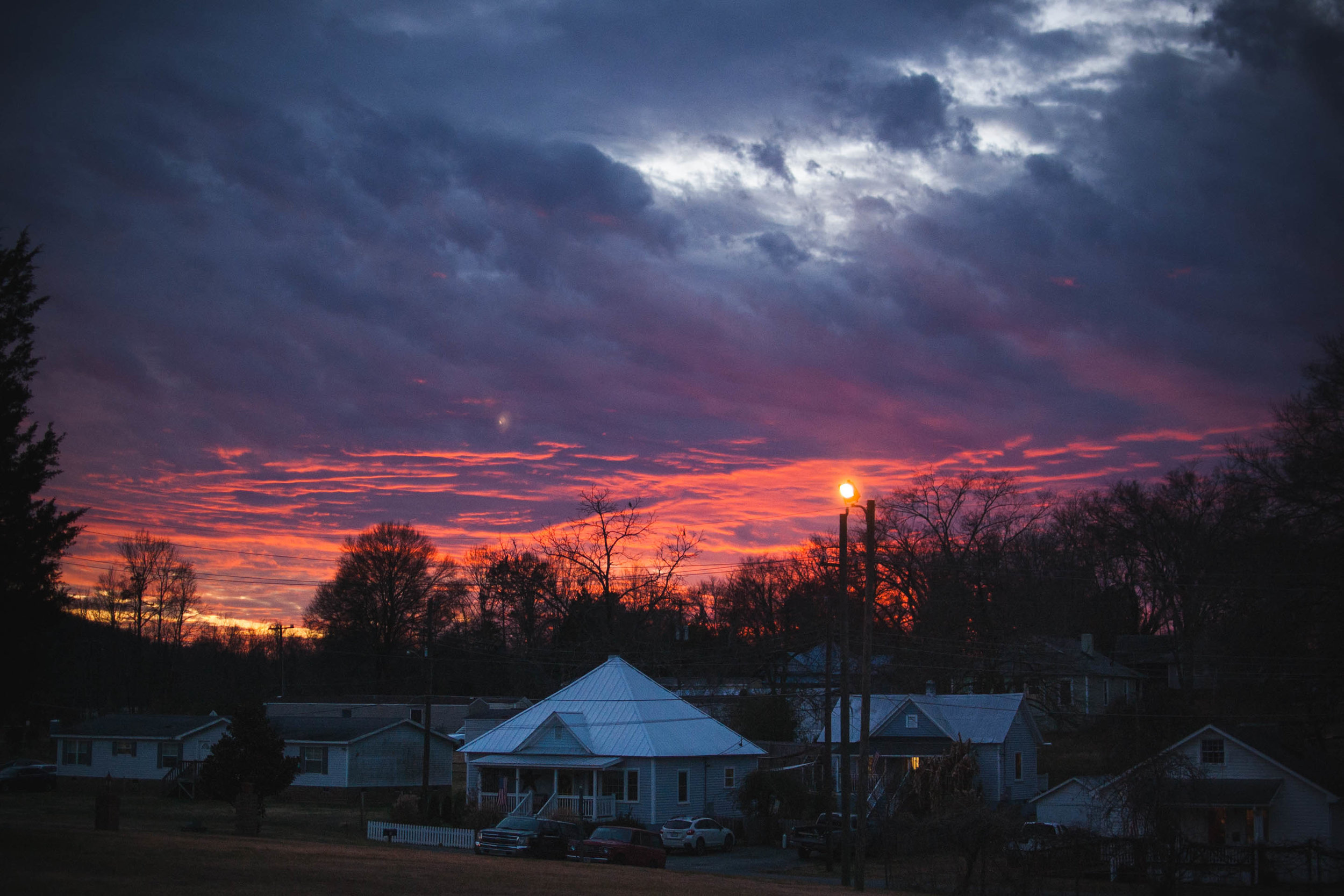 A fiery sun sets over Hillsborough, North Carolina