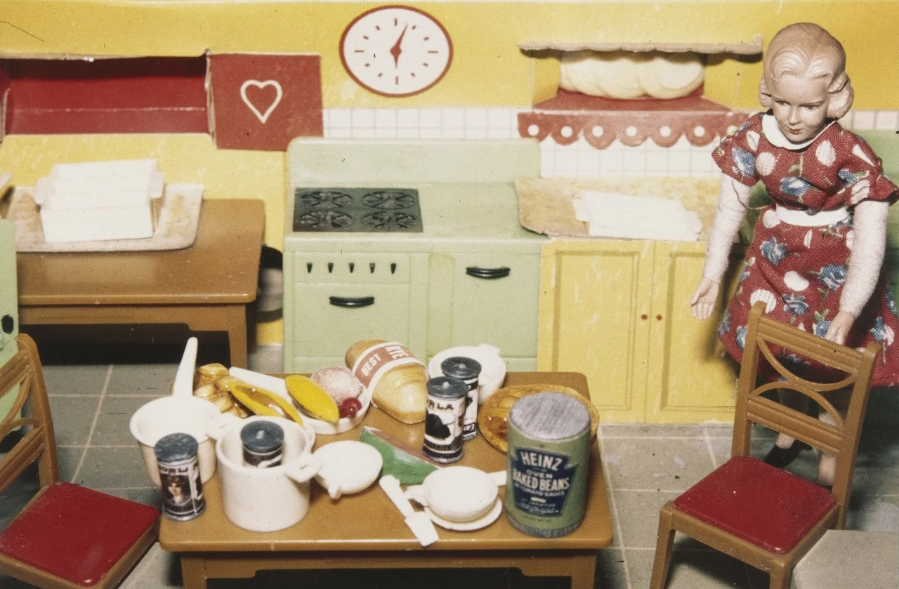 Laurie Simmons. Blonde/Red Dress/Kitchen . 1978. Silver dye bleach print, 3 1/4 x 5" (8.3 x 12.7 cm). The Museum of Modern Art, New York. Joel and Anne Ehrenkranz Fund. © 2016 Laurie Simmons
