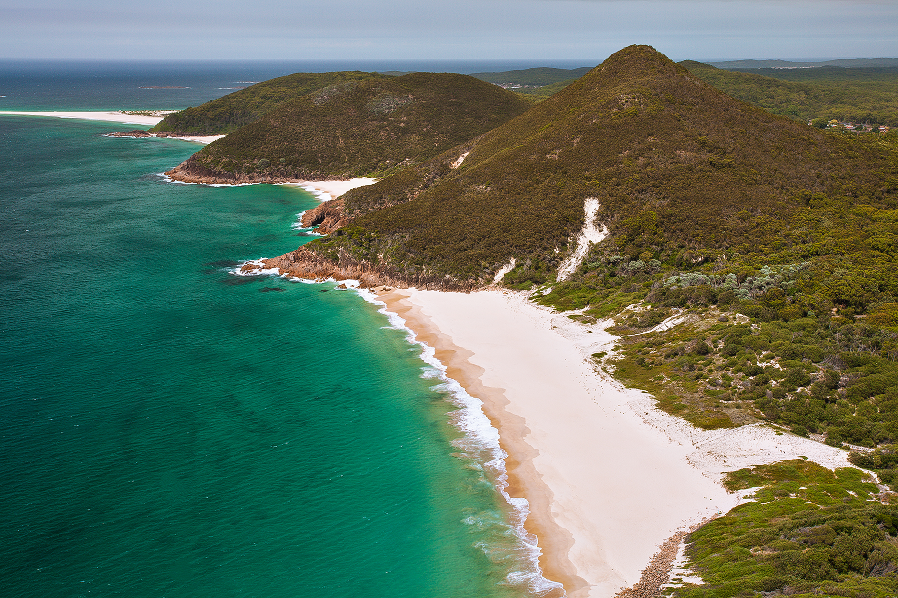 Photograph of Zenith Beach taken from the lookout at the summit of Mount Tomaree