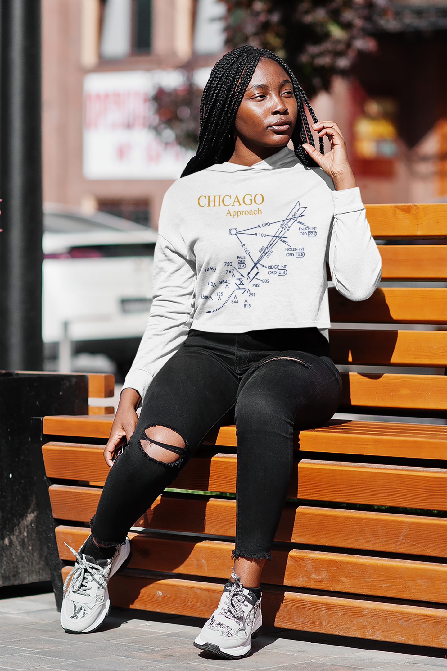 crop-top-hoodie-mockup-featuring-a-woman-sitting-on-a-street-bench-m7105-r-el2 (1).png