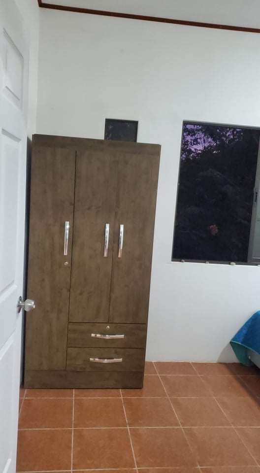 Clothing armoire in each bedroom on top floor apartment