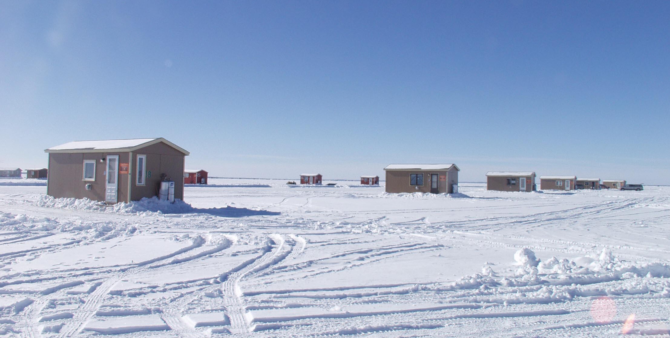 Fish houses on Mille Lacs Lake. Must be early in the season because there aren't very many on the ice yet. 