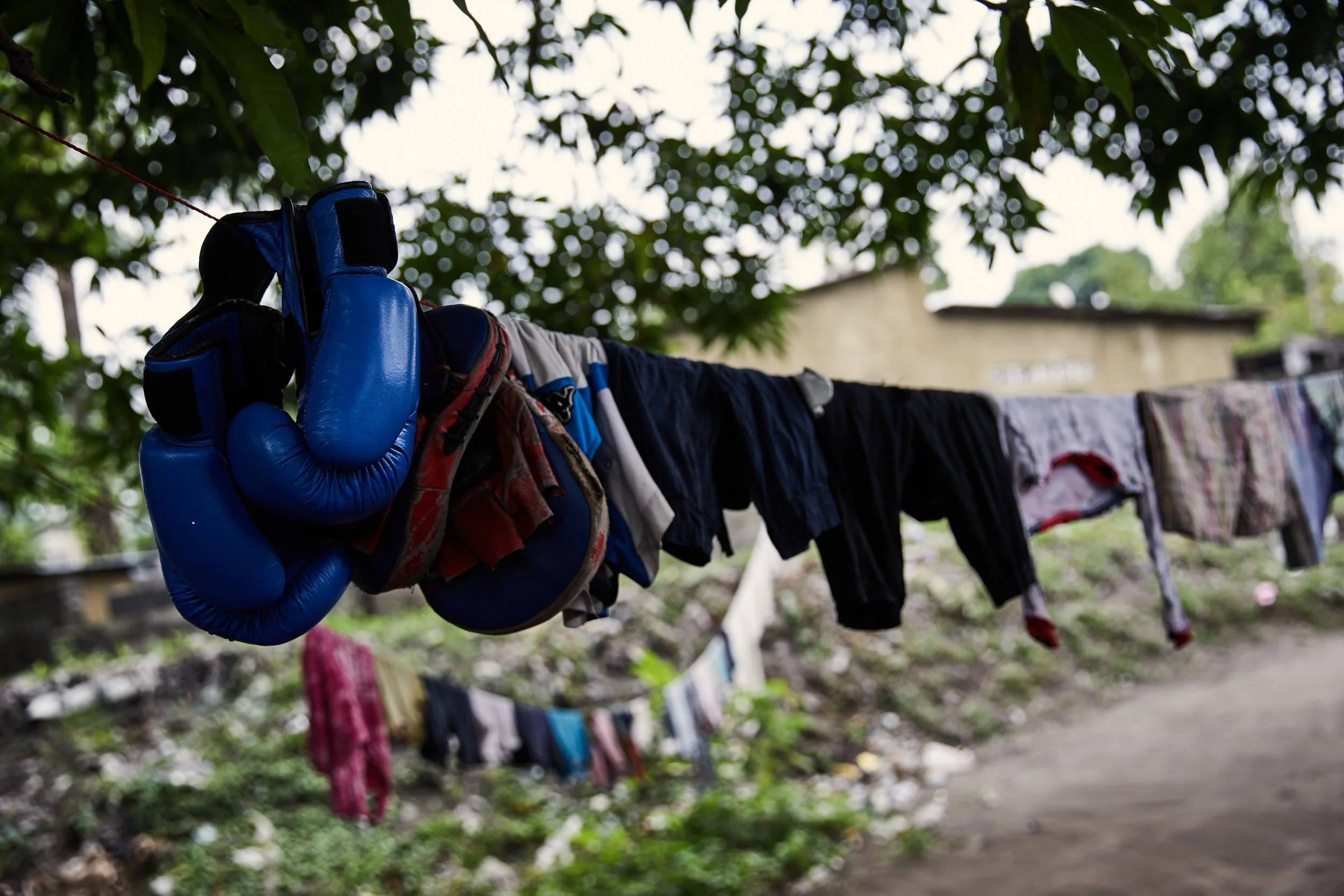 Gloves on the washing line at the home of Miki Ndaya, a boxer in Kinshasa.