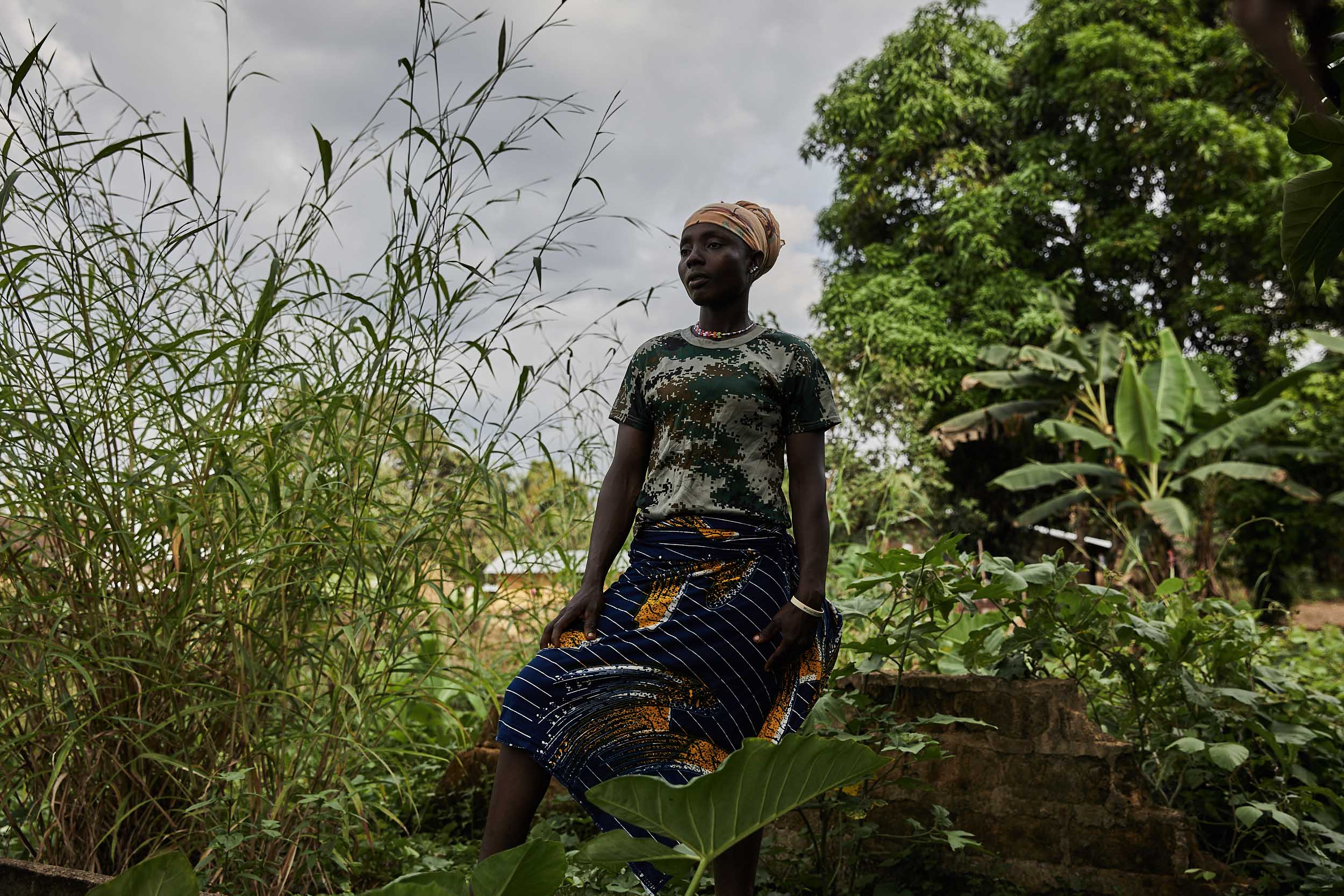 Mae-Jean Singbe lost 3 members of her family in Mawah during the Ebola crisis, her daughter, father and uncle. She lacks the means to move away and works as a gardener and a trader.