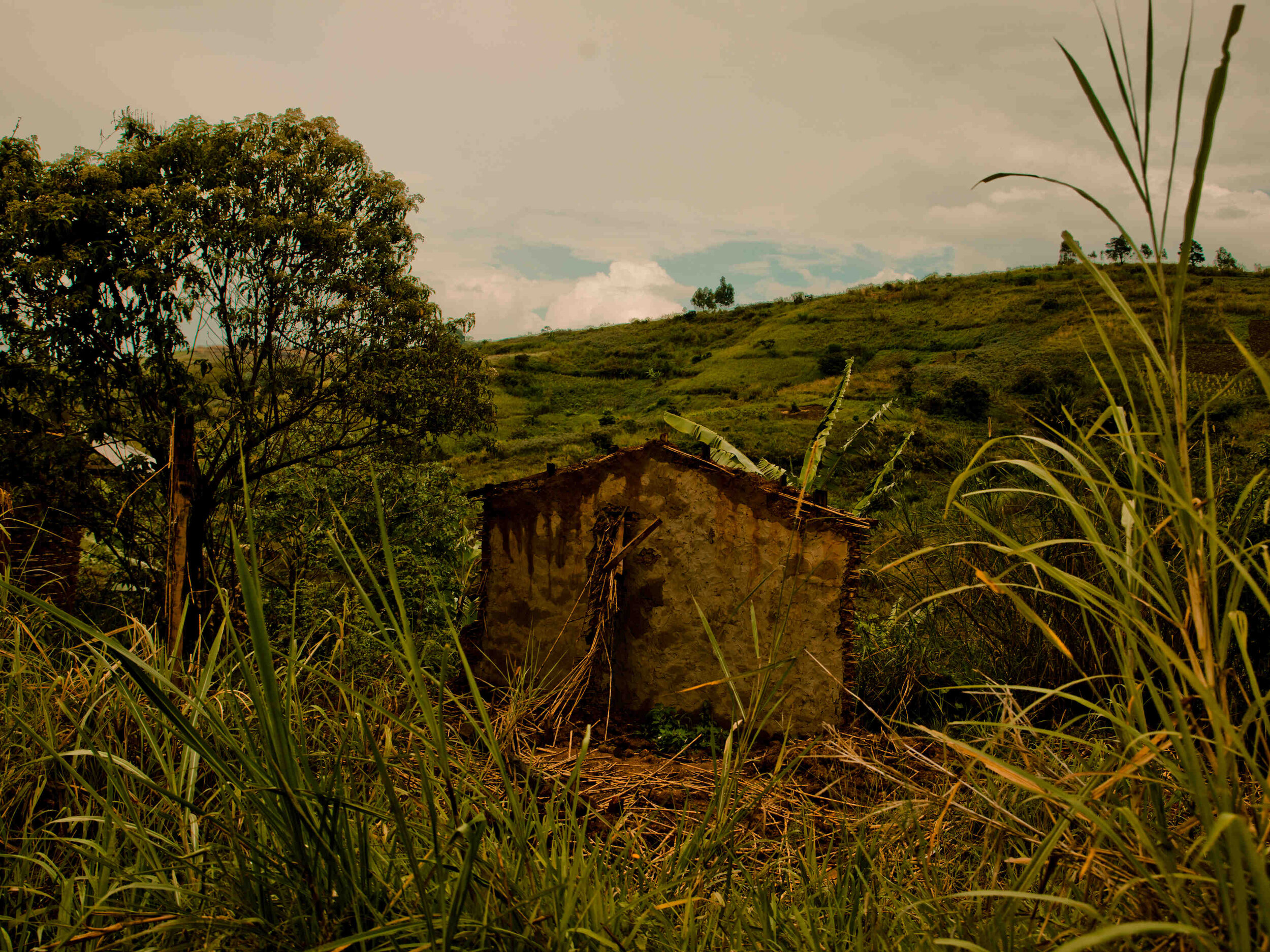  A single wall stands in the midst of a village razed by CODECO rebels in Djugu Territory.  