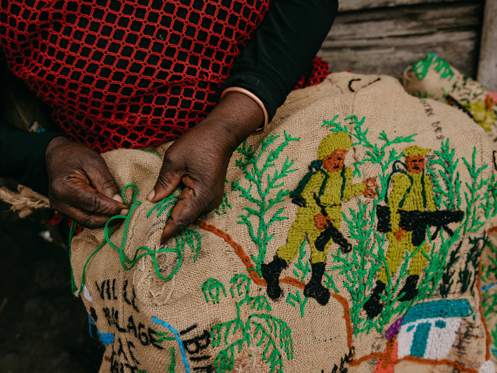  80 year old tapestry artist Lucie Kamusekera displays her works at home in the city of Goma, North Kivu Province.  