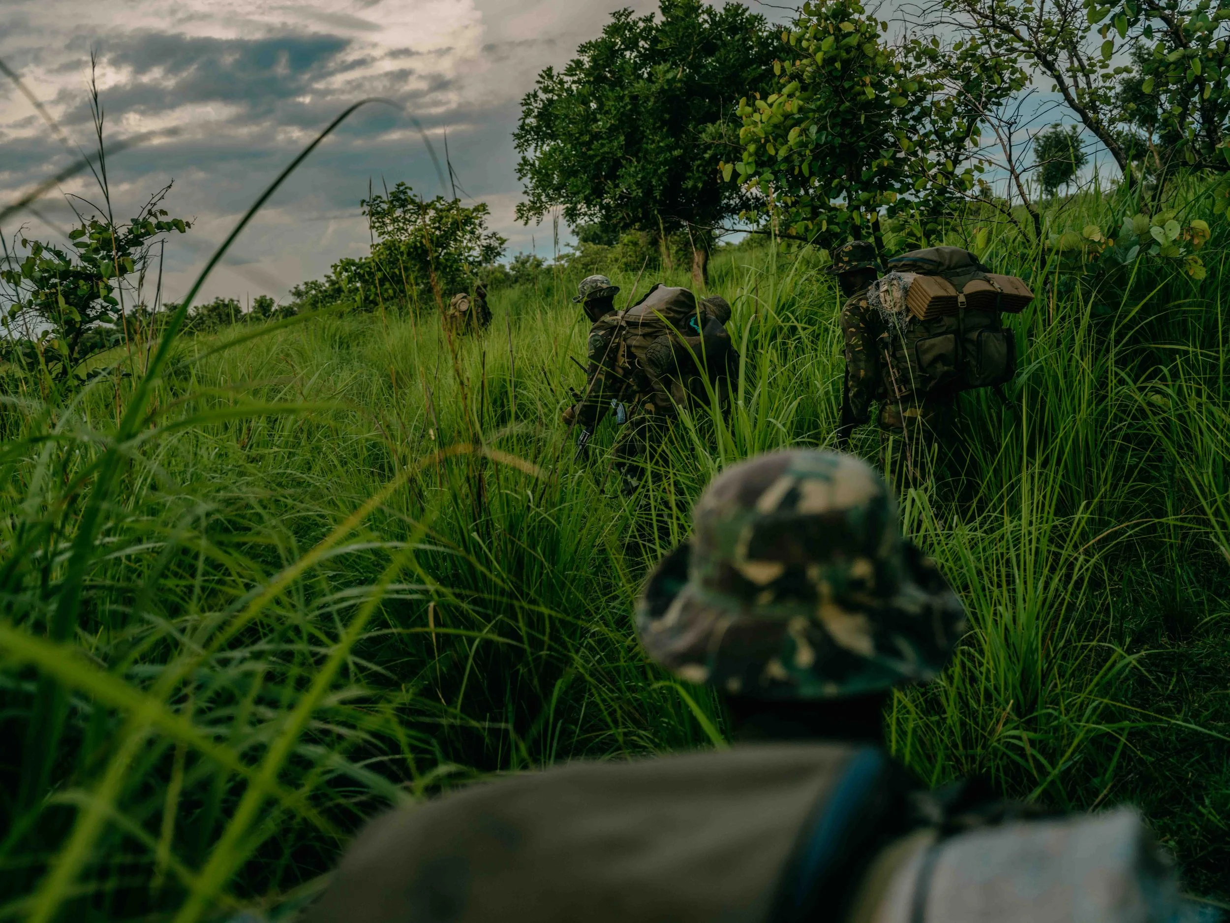 Garamba National Park rangers on patrol in grassland, Haut-Uele, DRC.