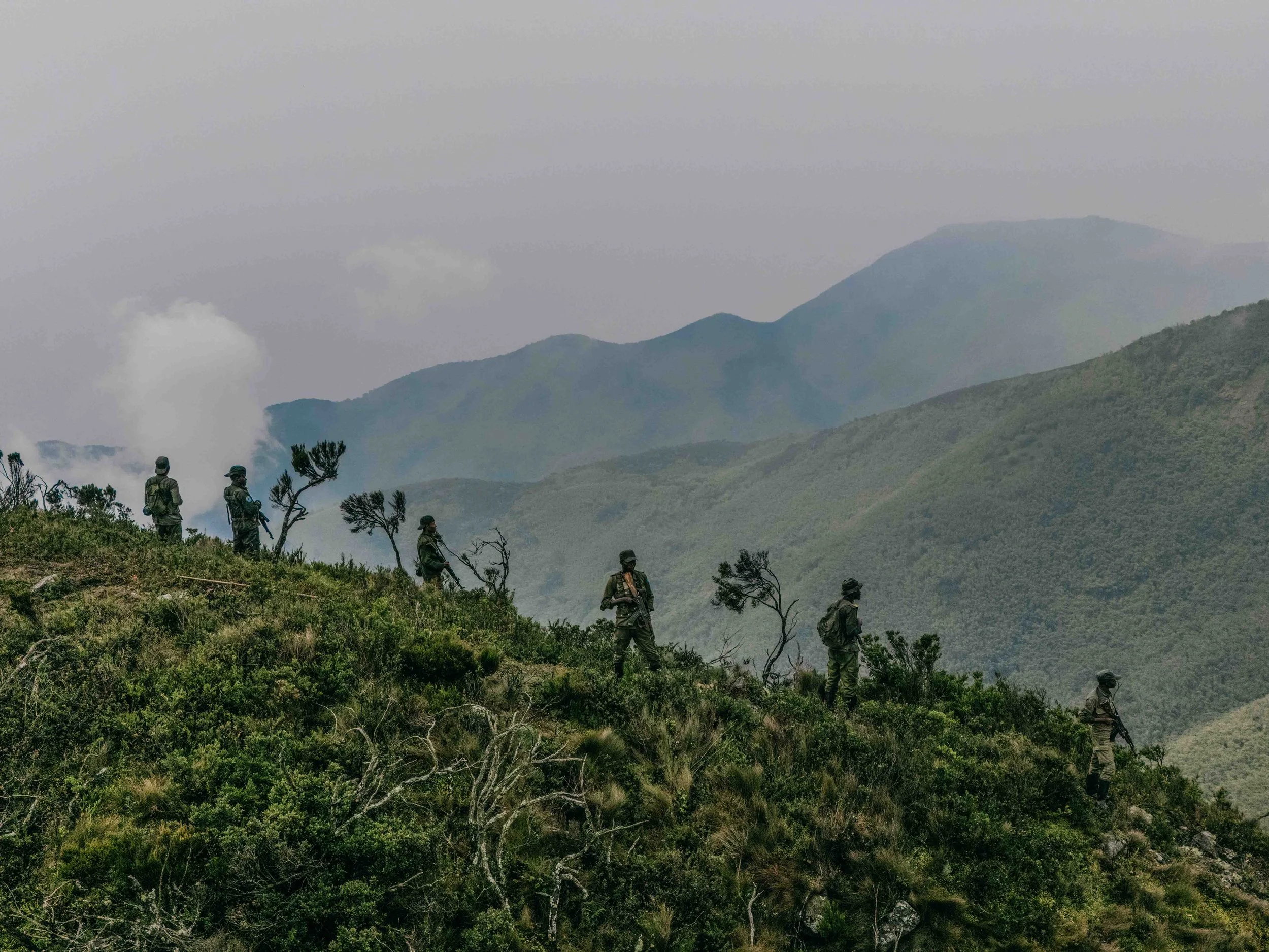 Rangers on a Ridgeline ascending the 3,308 metres high Mount Kahuzi, South Kivu, DRC.