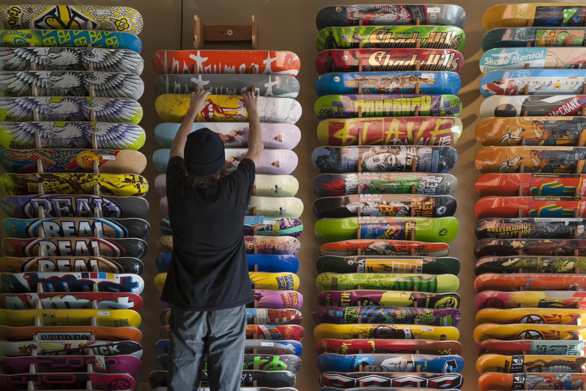 Flipside has a variety of boards stacked from the floor to the ceiling.