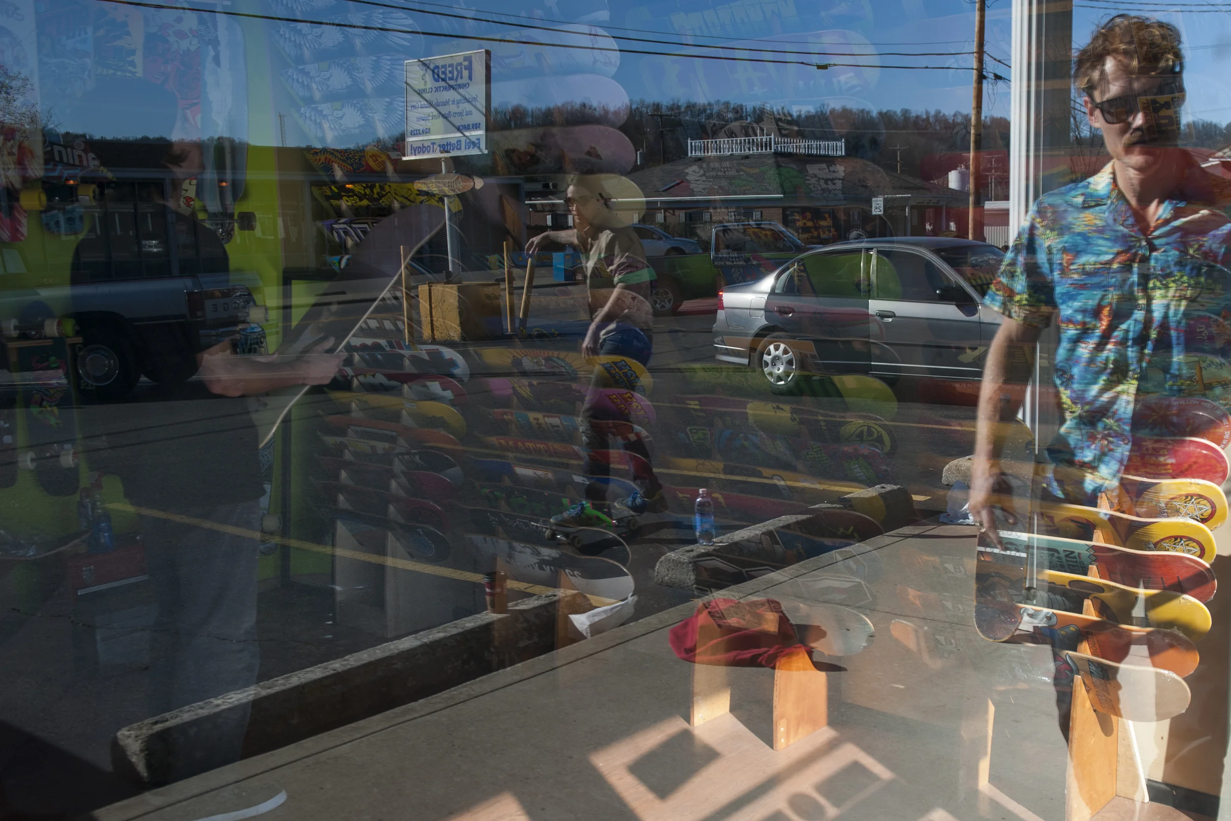 Moss Miller walks outside Flipside skate shop while he waits more of the crew to arrive. 