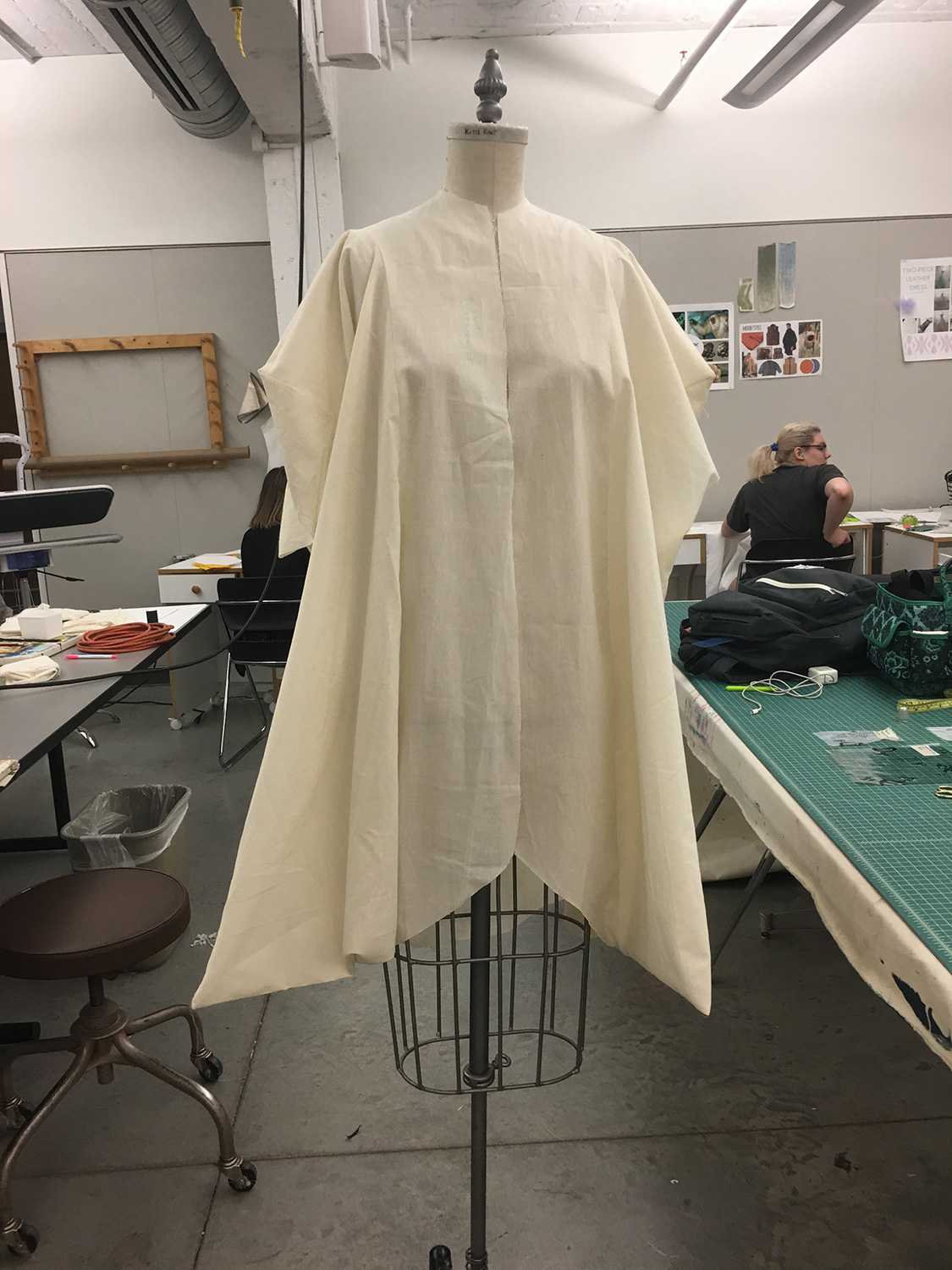 After deconstructing the original drape, I continued to alter the pattern on paper. Mock up above #3. Due to material, the pattern could only consist of straight lines.