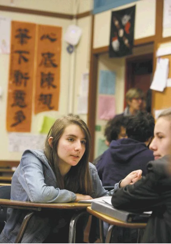 Photos by Lea Suzuki / The Chronicle Freshmen Aida Piriyeva and Dennis Leverant work together on a class assignment during ethnic studies class at Washington High School.