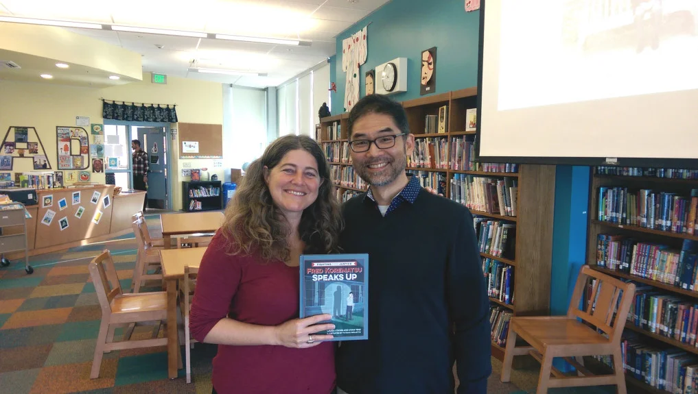 Laura Atkins and Stan Yogi are the authors of a new children’s book on civil rights icon Fred Korematsu titled “Fred Korematsu Speaks Up.” Korematsu is known for fighting the World War II internment of Japanese Americans. The authors are posing with a copy of the book at the library of Jefferson Elementary School in Berkeley, where they recently spoke to students. A book launch is scheduled from 2 to 4 p.m. Feb. 4 at J-Sei center, 1285 66th St., Emeryville. (Courtesy of Adoria Williams)