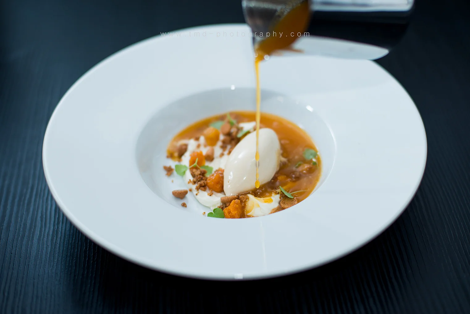  Dessert with cloudberries, caramel ice cream, almond biscuits and a hot cloudberrysoup