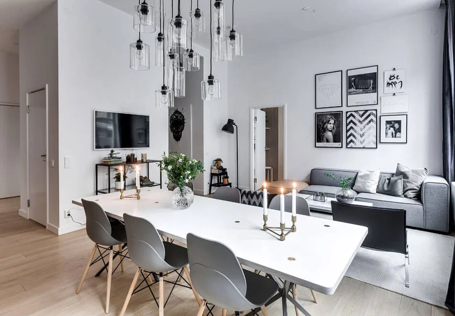 Try clustering pictures or wall images for maximum impact - particularly if you are lucky enough to have nice high ceilings like this gorgeous apartment! Image source found here