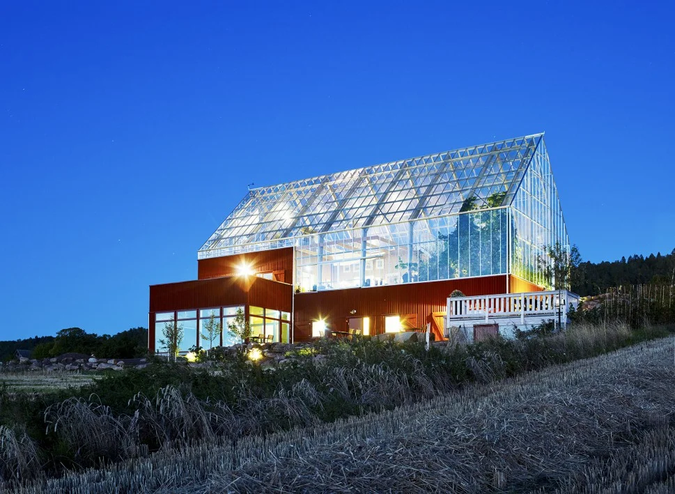 The Nature House concept (or Naturhus in Swedish) was developed by Swedish architect Bengt Warne in the 1970s. The houses consists of a core - a living area, that is surrounded by a shell of glass - a greenhouse. The greenhouse sets the insulated inner core in a warmer climate and provides sheltered "outdoor space" from the cold northern winter. It gives you the possibility to grow plants from warmer climate zones and preheats air for ventilation.
