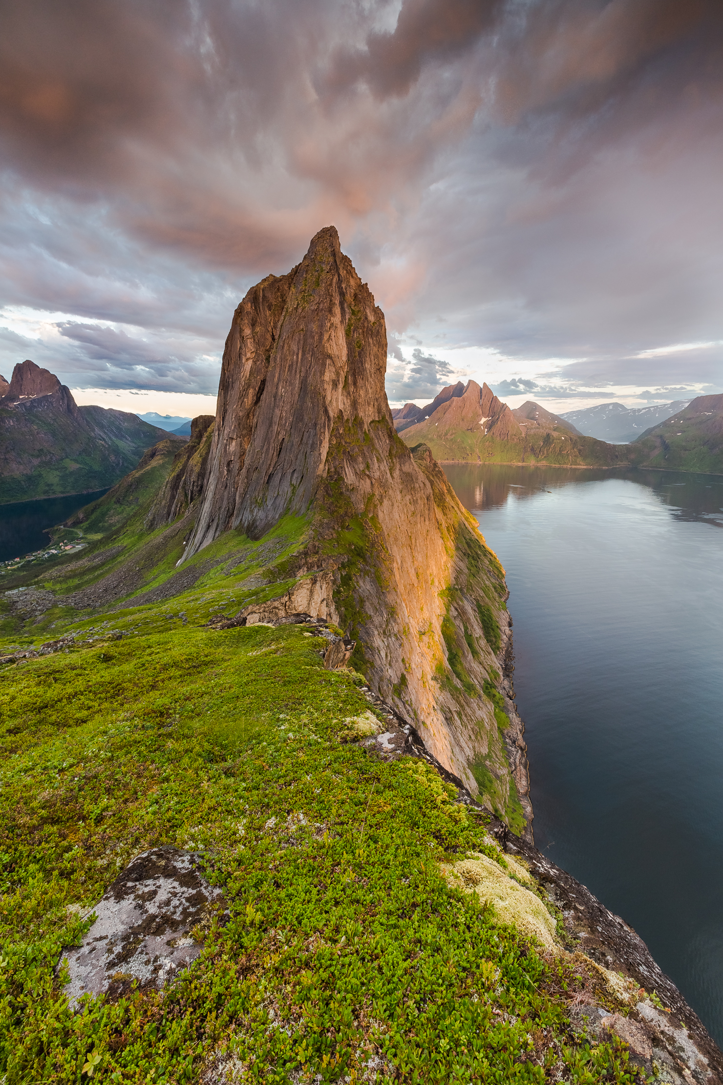 Segla Mountain - "This is the most amazing mountain you can imagine, and my absolute favourite mountain at Senja Island - Troms. The heat of the day created these great rainy clouds with warm colours this early summer evening in July"