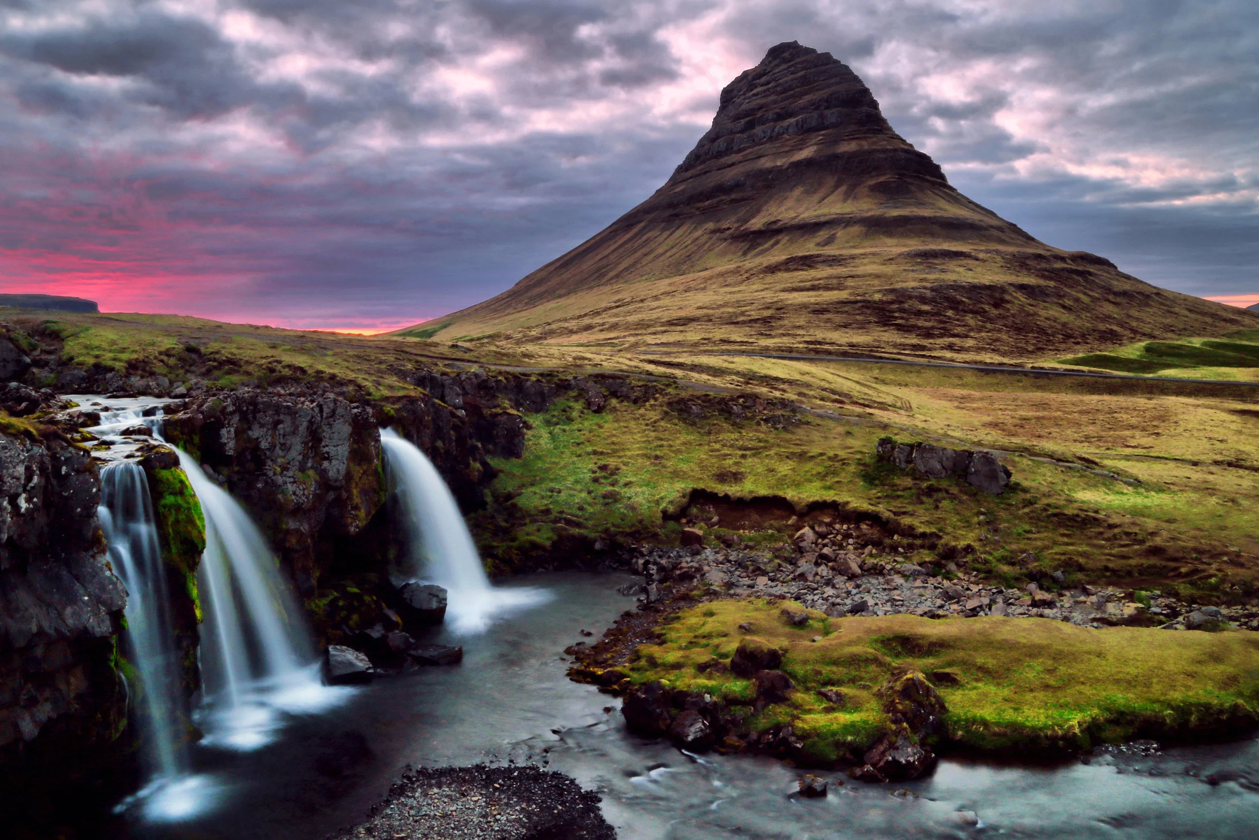Kirkjufellis a beautifully shaped and a symmetric, free standing mountain in Iceland. Its name means "Church Mountain“ in Icelandic.