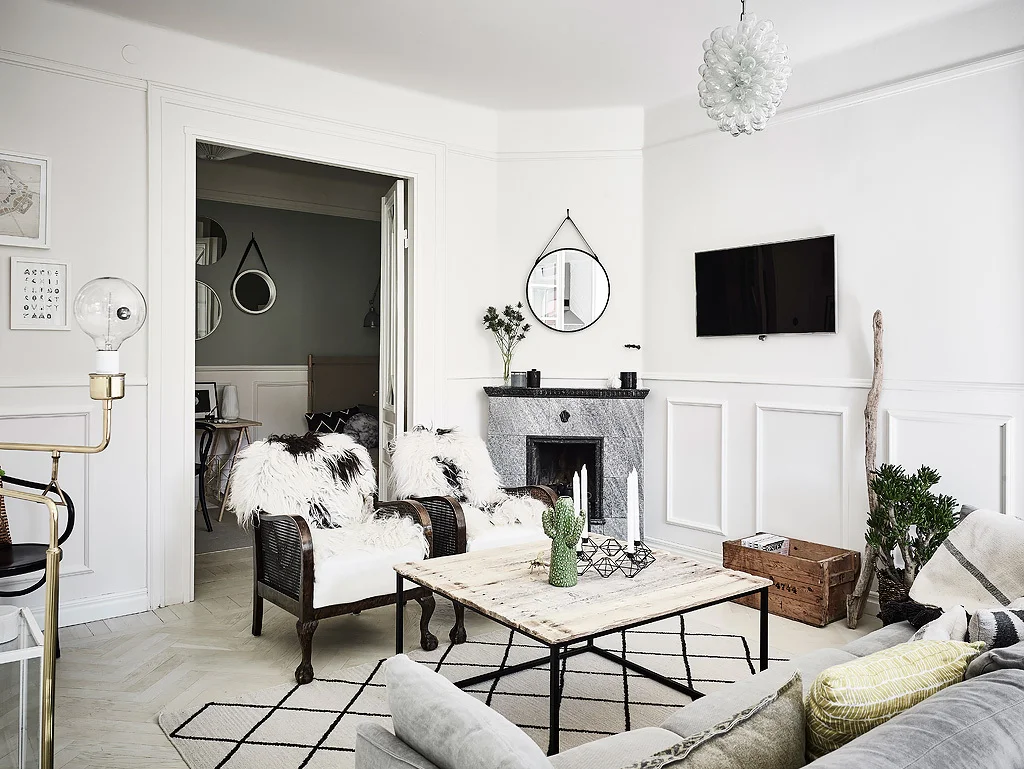 This industrial style coffee table with cosy cushions and furs really makes for a 'hygge' home. 