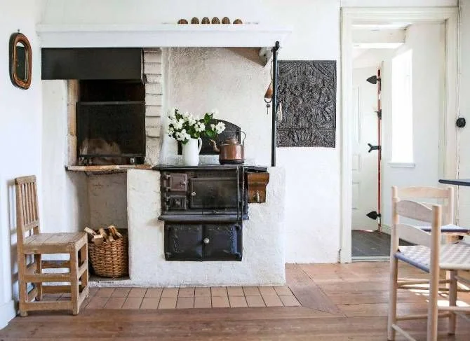 We love the rustic, cottage feel and unfussy style of this beautiful country home. We would certainly love to have an original oven like this in our home! Simple but cosy, with light wood furniture and minimal decor. Image source
