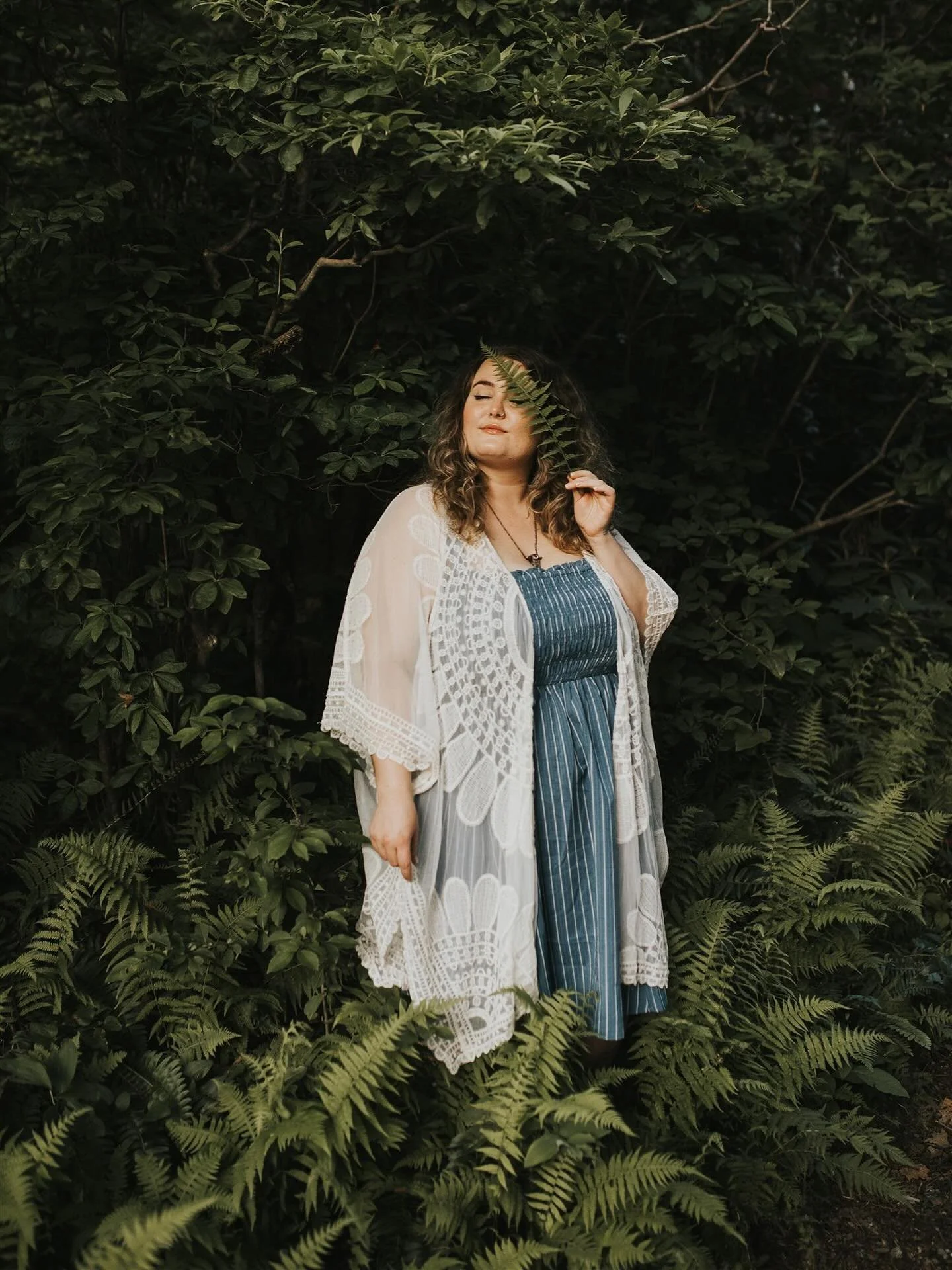 Allexis with ferns in the summertime.