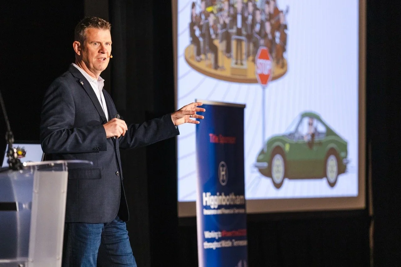 Dave Delaney, keynote speaker and communication coach, on stage