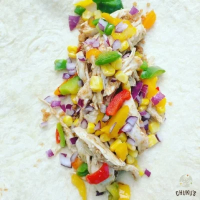 Our honey suya chicken Eko Burrito - The Alade