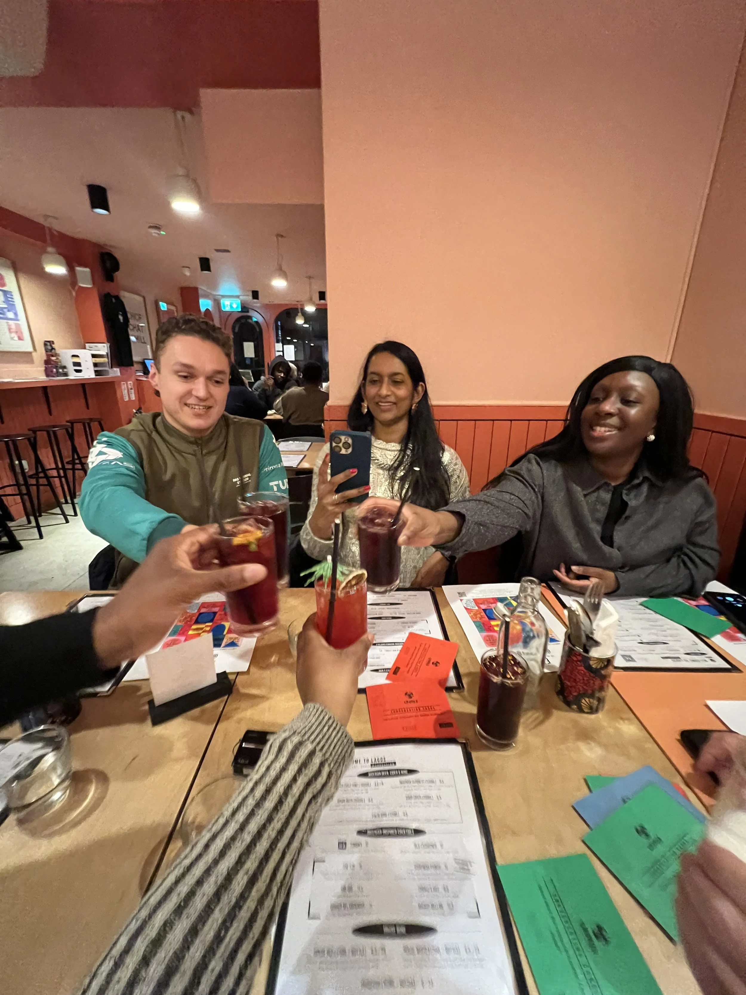 Chuku's guests cheersing at the Ejikoro table